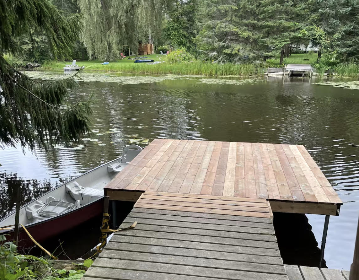 Wood dock extending into a calm lake